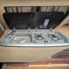 Detailed hob and sink area in VW T6.1 LWB campervan kitchen setup