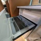 Hidden cutlery tray integrated in kitchen of VW T6.1 LWB campervan