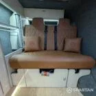 Toffee upholstered rock and roll bed in VW T6.1 LWB campervan