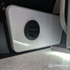 Diesel night heater fitted beneath white kitchen in VW T6.1 SWB campervan