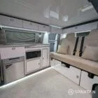VW T6.1 SWB campervan kitchen interior with winter flooring, white units and silver birch accents