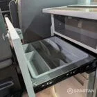 Close-up of slate grey kitchen units with Nolche Marino detail in VW T6.1 SWB campervan