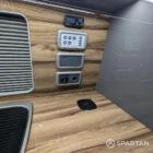 Wireless charger and control panel installed in Nolche Marino and slate grey kitchen in VW T6.1 SWB campervan