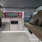 Spartan campervan kitchen with premium white gloss and poppy red splashback FL73HBK