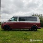 Passenger side view of VW T6.1 Business Pack LWB campervan with roof down, Fortana Red and Candy White