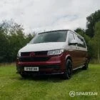 Front passenger quarter of VW T6.1 Business Pack LWB campervan with roof down, Fortana Red and Candy White