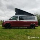 Passenger side view of VW T6.1 Business Pack LWB campervan with pop-top up, Fortana Red and Candy White