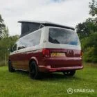 Rear passenger quarter of VW T6.1 Business Pack LWB campervan with pop-top up, Fortana Red and Candy White