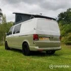 Rear passenger quarter of VW T6.1 LWB campervan with pop-top up, Military Green and Candy White