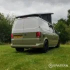 Rear driver quarter of VW T6.1 LWB campervan with roof raised, Military Green and Candy White