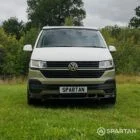 Front view of VW T6.1 LWB campervan with pop-top down, Military Green and Candy White