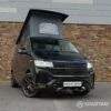 Spartan VW T6.1 Highline Deep Black Pearl camper front 3/4 view with wheel turned in WK72VDP