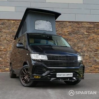 Spartan VW T6.1 Highline Deep Black Pearl camper front 3/4 view with wheel turned in WK72VDP