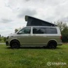 Passenger side view of VW T6.1 Highline SWB campervan with pop-top up, Military Green and Candy White
