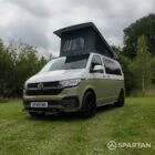 Front passenger quarter of VW T6.1 Highline SWB campervan with pop-top up, Military Green and Candy White
