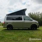 Driver side view of VW T6.1 Highline SWB campervan with pop-top up, Military Green and Candy White