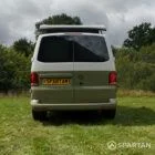 Straight rear view of VW T6.1 Highline SWB campervan with pop-top up, Military Green and Candy White
