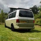 Rear passenger quarter of VW T6.1 Highline SWB campervan with pop-top up, Military Green and Candy White