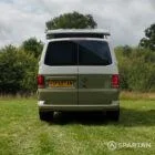 Straight rear view of VW T6.1 Highline SWB campervan with pop-top up, Military Green and Candy White