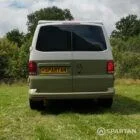 Rear view of VW T6.1 Highline SWB campervan with pop-top down, Military Green and Candy White