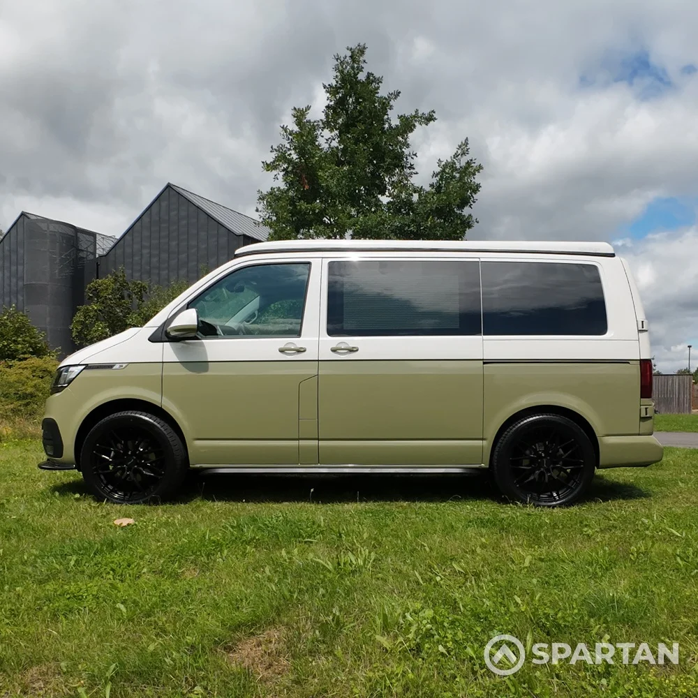 Passenger side view of VW T6.1 Highline SWB campervan with roof down, Military Green and Candy White