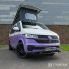 Vw T6.1 SWB Spartan campervan conversion. Front driver quarter with pop top roof up