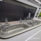 Detailed hob and sink area in VW T6.1 Business Pack LWB campervan kitchen setup