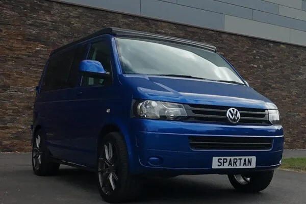 Front Driver Quarter Poptop Down - VW T5.1 SWB Ravenna Blue campervan with Blizzard flooring, light grey and Indigo Blue interior, two tone blue upholstery