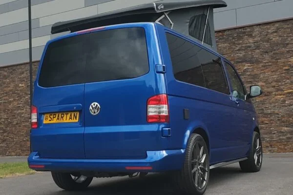 Rear Driver Quarter Poptop Up - VW T5.1 SWB Ravenna Blue campervan with Blizzard flooring, light grey and Indigo Blue interior, two tone blue upholstery