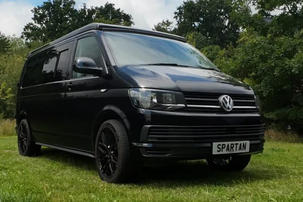 VW T6 LWB Deep Black campervan front driver quarter view poptop down
