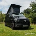 VW T6 LWB Deep Black campervan front driver quarter view poptop up