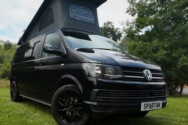 VW T6 LWB Deep Black campervan front driver quarter view poptop up