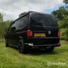 VW T6 LWB Deep Black campervan rear passenger quarter view poptop down