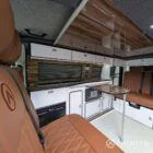 Interior kitchen view VW T6.1 Candy White & Copper Bronze campervan with Winter flooring, high gloss cabinetry and Nolche Marino worktop