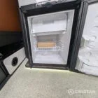 Interior kitchen view VW T6.1 Candy White & Copper Bronze campervan with Winter flooring, high gloss cabinetry and Nolche Marino worktop