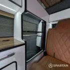 Interior wardrobe view VW T6.1 Candy White & Copper Bronze campervan with Winter flooring and white high gloss cabinetry