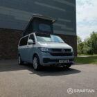 VW T6.1 SWB Squirrel Grey and Candy White campervan front driver quarter poptop up by Spartan Campers