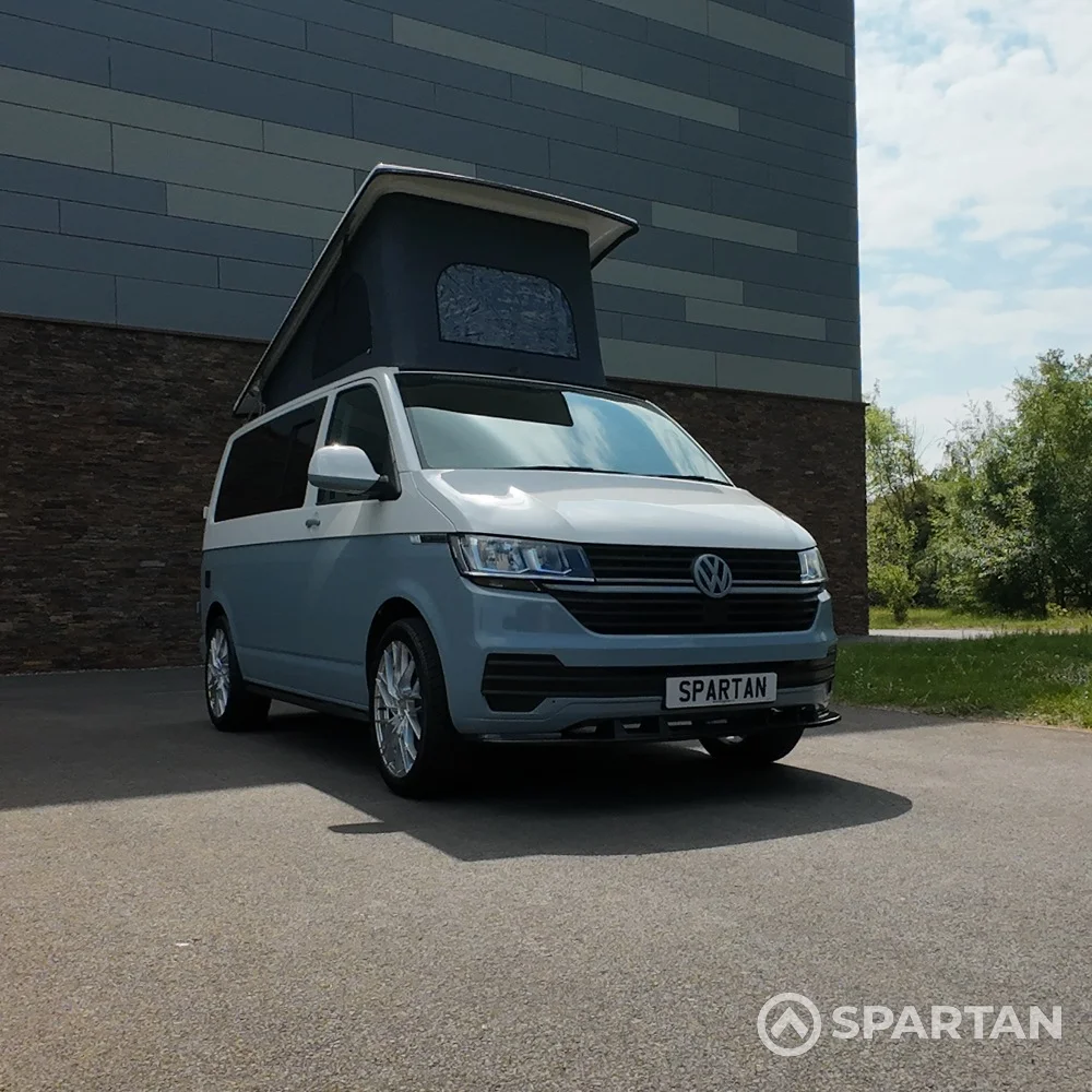 VW T6.1 SWB Squirrel Grey and Candy White campervan front driver quarter poptop up by Spartan Campers