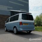 VW T6.1 SWB Squirrel Grey and Candy White campervan rear passenger quarter poptop up by Spartan Campers