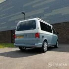 VW T6.1 SWB Squirrel Grey and Candy White campervan rear driver quarter poptop down by Spartan Campers