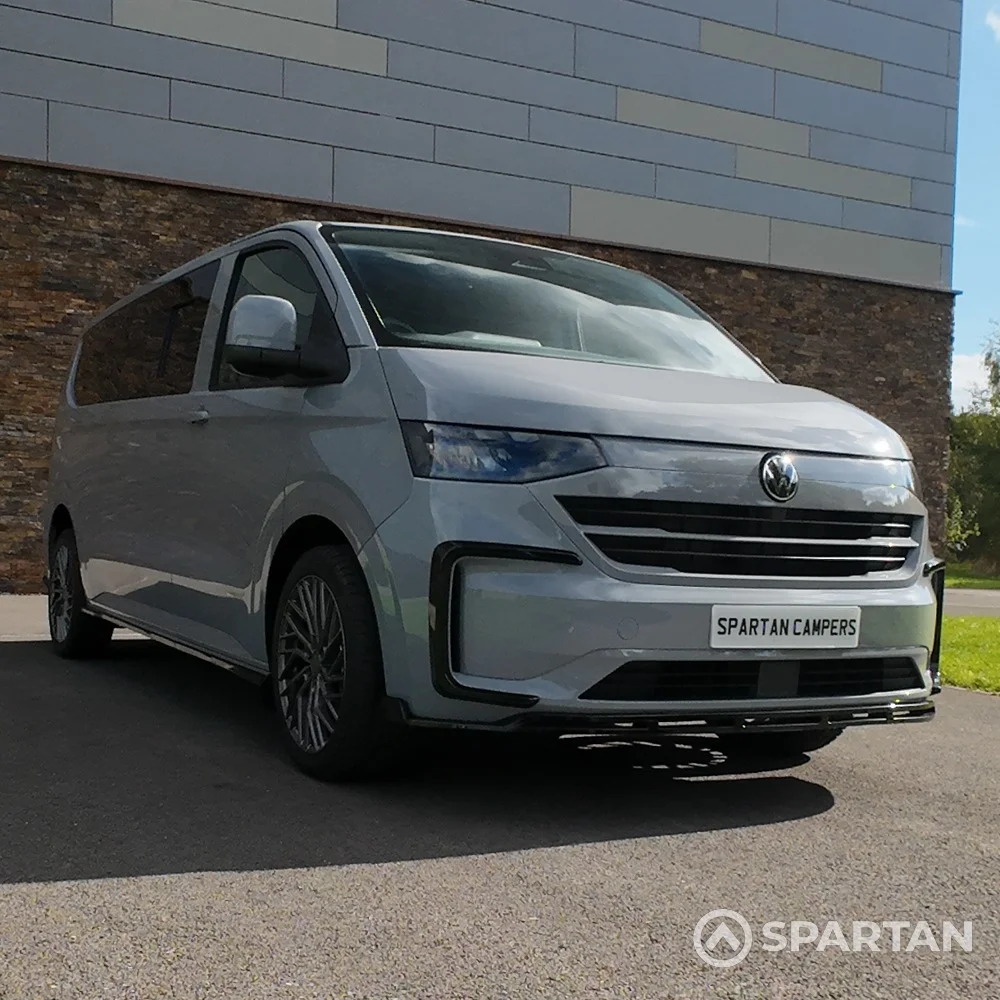 VW T7 Camper driver-side front quarter view — Spartan Camper conversion with clean body lines, alloy wheels, and distinctive front styling.