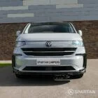 VW T7 Camper driver-side front quarter view — Spartan Camper conversion with clean body lines, alloy wheels, and distinctive front styling.