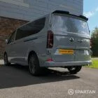 VW T7 Camper passenger-side rear quarter view — new VW T7 conversion from Spartan Campers showing compact proportions, stylish finish, and camper-ready build.