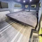 WV T7 day van interior with removable kitchen unit and mobiframe bed on rails