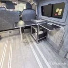 WV T7 day van interior with removable kitchen unit and mobiframe bed on rails