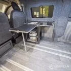 WV T7 day van interior with removable kitchen unit and mobiframe bed on rails