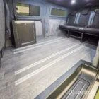 WV T7 day van interior with removable kitchen unit and mobiframe bed on rails