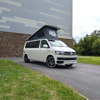 2018 VW T6 Spartan Conversion in two-tone Candy White and Ascot Grey, DSG automatic, parked on display.