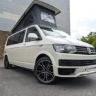 2018 VW T6 Spartan Conversion in two-tone Candy White and Ascot Grey, DSG automatic, parked on display.