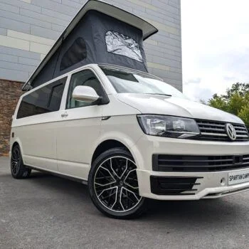 2018 VW T6 Spartan Conversion in two-tone Candy White and Ascot Grey, DSG automatic, parked on display.